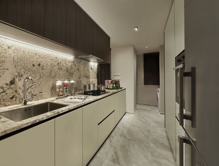 Sleek kitchen with a Miele hood, hob and oven, and Liebherr refrigerator.